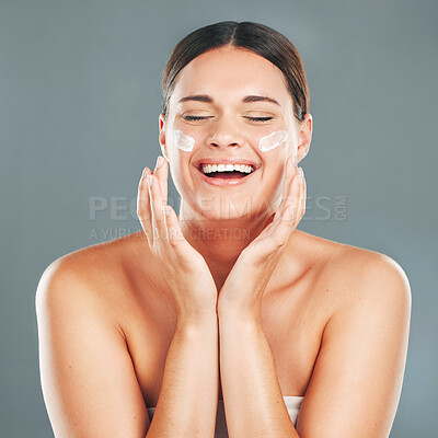 Buy stock photo Woman apply cream for face, happy laugh and beauty, skincare and moisturizer isolated on studio background. Sunscreen, lotion and healthy skin with glow, wellness and facial treatment with happiness