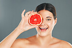 Grapefruit, skincare, woman or aesthetic wellness for healthy diet, happy results or clean glowing on grey background. Beauty portrait, smile or girl model face, facial makeup or cosmetics for health