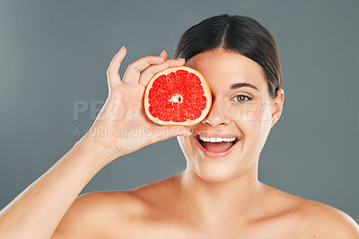 Buy stock photo Grapefruit, skincare, woman or aesthetic wellness for healthy diet, happy results or clean glowing on grey background. Beauty portrait, smile or girl model face, facial makeup or cosmetics for health
