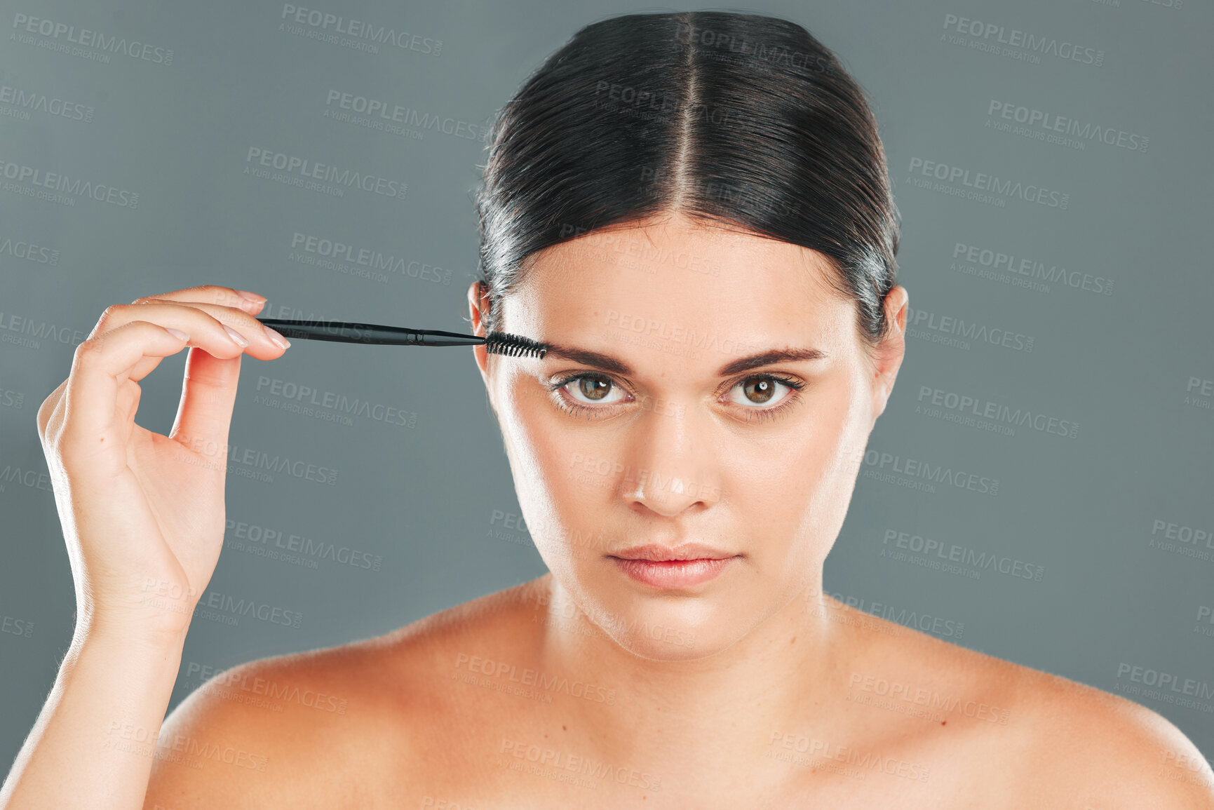 Buy stock photo Eyebrow brush, beauty and portrait of woman in studio for headshot, skincare transformation and cosmetics. Face, makeup and brushing brows with facial tool, model and hair on eyes for clean aesthetic