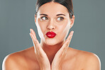 Woman lips with lipstick, kiss face and makeup with red cosmetics and playful pout isolated on studio background. Healthy skin, beauty and skincare with cosmetic care, wellness and facial glow