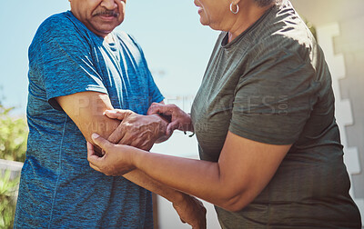 Buy stock photo Senior, man arm injury and woman helping husband after exercise, fitness and workout accident. Elderly, arthritis and joint pain with a couple in retirement outdoor for health and wellness activity