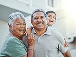 Grandparents, portrait and senior man and woman are happy with grandchild outside new home. Elderly, retirement and happiness together by old people on vacation or holiday with kid or child