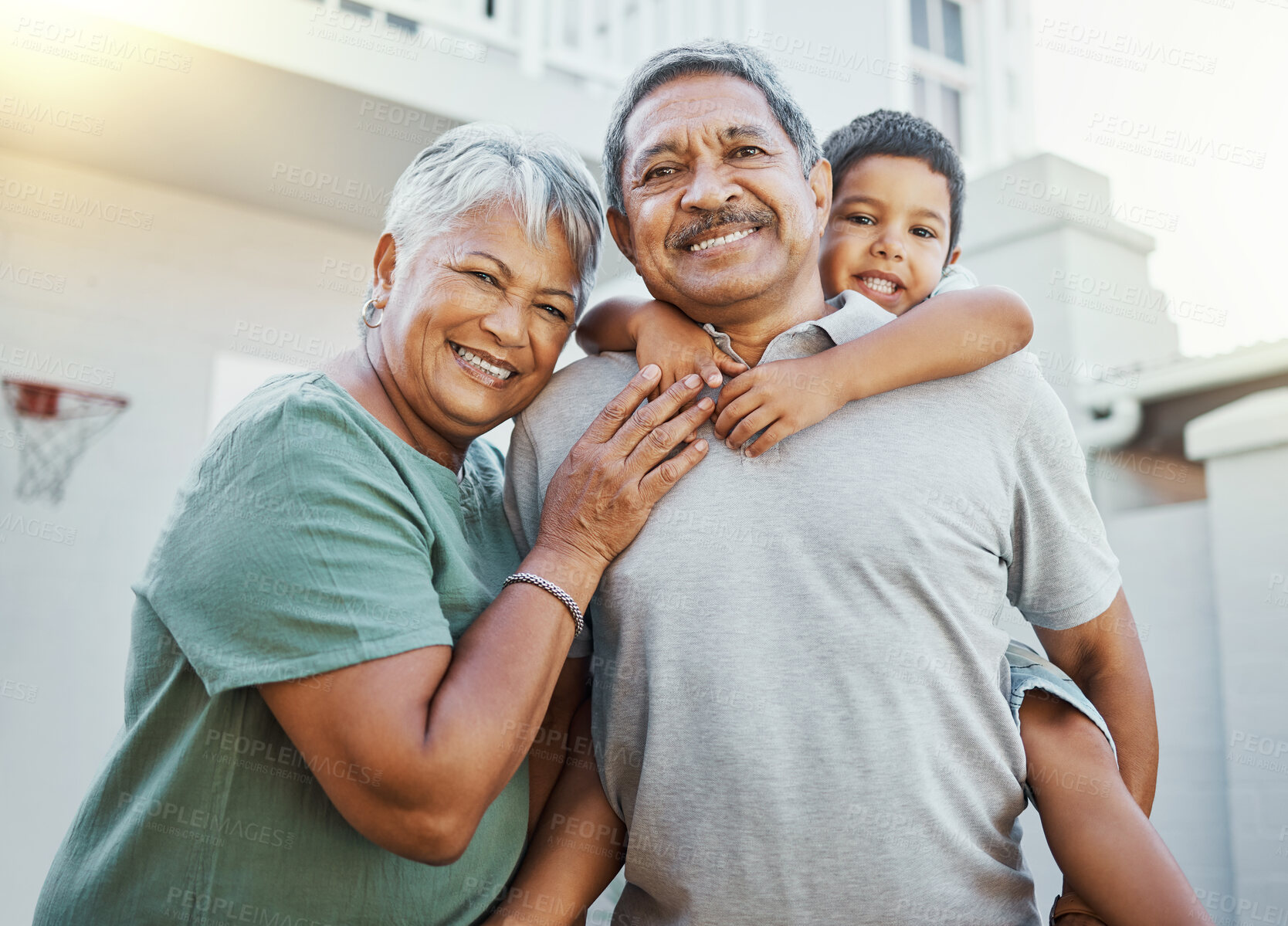 Buy stock photo Piggyback, love and portrait of grandparents with a child in the backyard of their family home. Happiness, smile and elderly man and woman in retirement bonding with grandson outdoor their house.