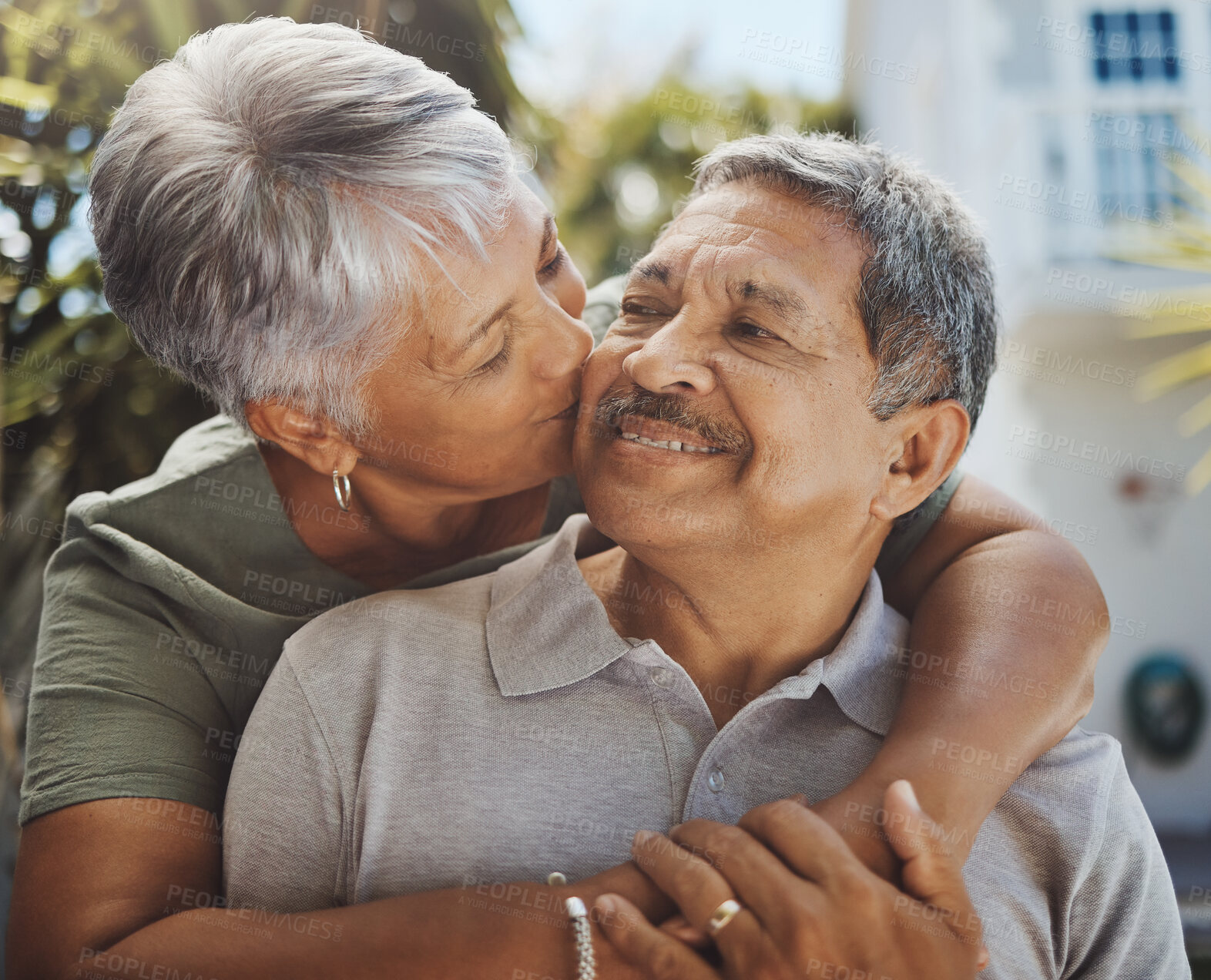 Buy stock photo Black senior couple, hug and kiss for love, retirement holiday and happiness outdoor together. African man, woman kissing and happy quality time or marriage relationship bonding on travel vacation