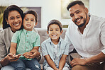 Father, mother and children with smile for family portrait, holiday break or weekend relaxing on living room sofa at home. Happy dad, mom and kids smiling for fun bonding time or relationship indoors