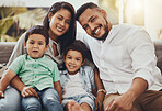 Father, mother and kids with smile for family portrait, holiday break or weekend relaxing on living room sofa at home. Happy dad, mom and children smiling in joy for fun bonding relationship indoors