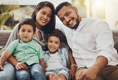 Buy stock photo Father, mother and kids with smile for family portrait, holiday break or weekend relaxing on living room sofa at home. Happy dad, mom and children smiling in joy for fun bonding relationship indoors