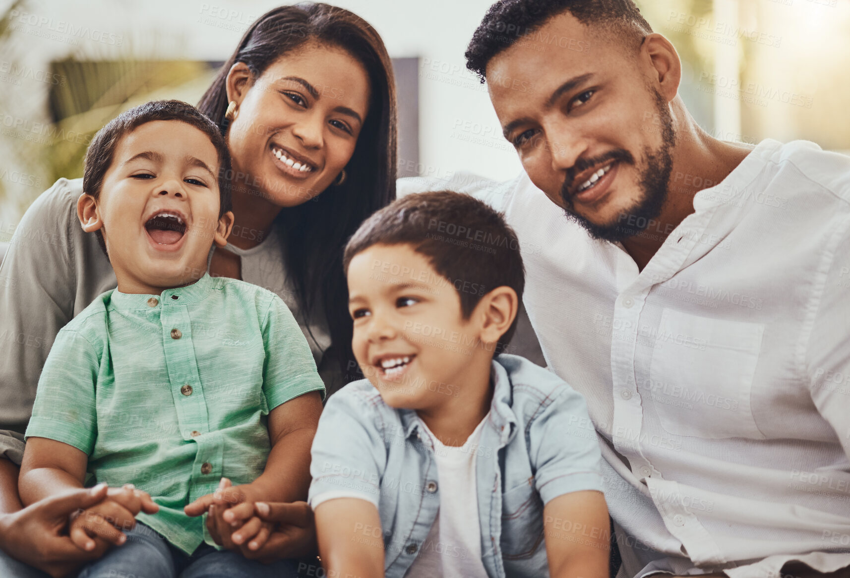 Buy stock photo Father, mother and children with smile for family time, holiday break or weekend relaxing on living room sofa at home. Happy dad, mom and kids smiling in joy for fun bonding or relationship indoors