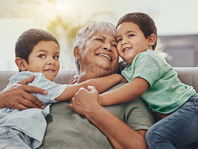 Buy stock photo Children, hug and grandmother on a sofa, happy and smile, love and laugh while bonding on their home visit. Kids, grandchildren and boy embrace grandma on a couch, relax and hugging in a living room