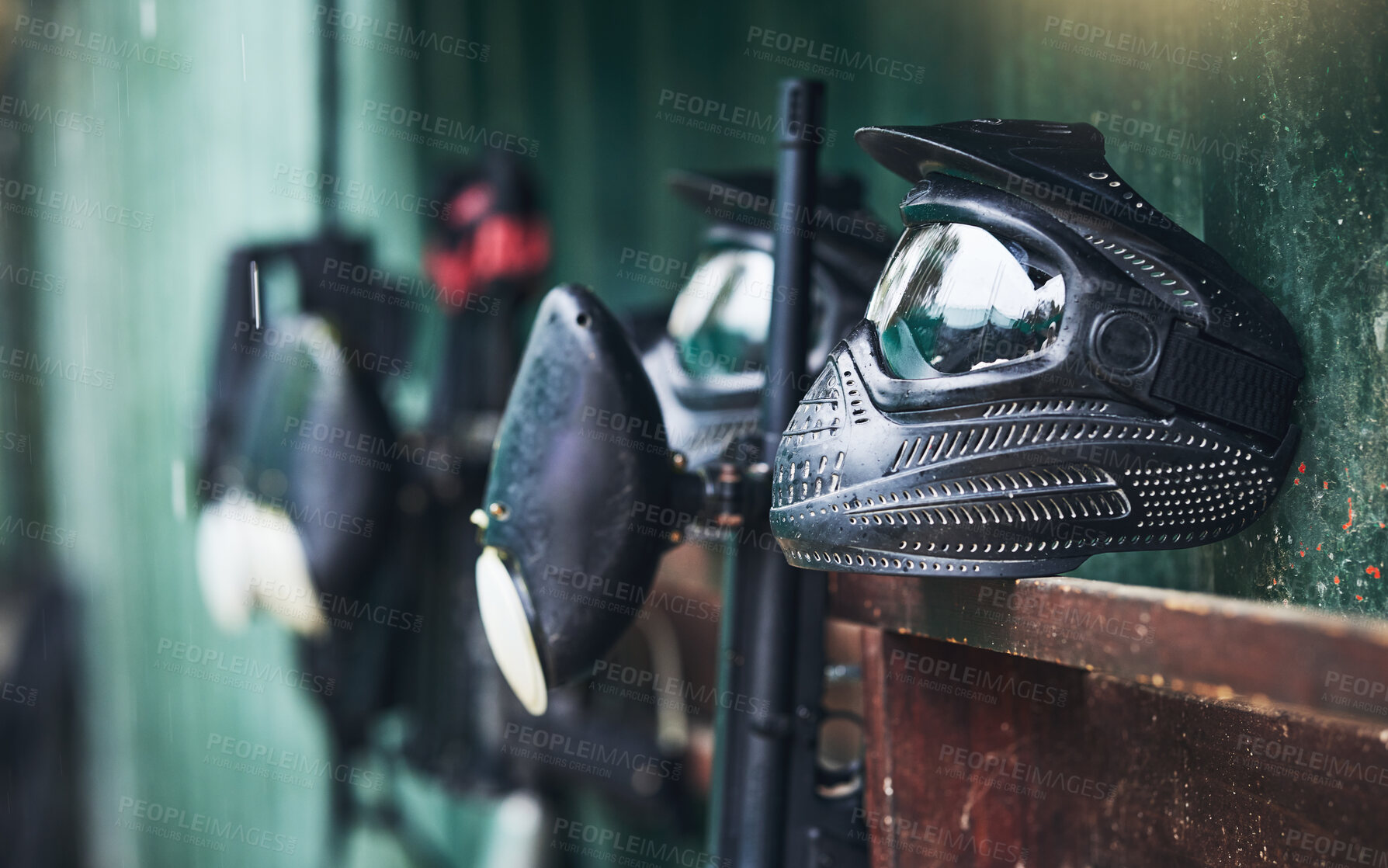 Buy stock photo Paintball, equipment and helmets or mask for protection for sports, competition or fun game. Sport, paint ball and safety gear for a recreation battle or competitive match by an outdoor battlefield.