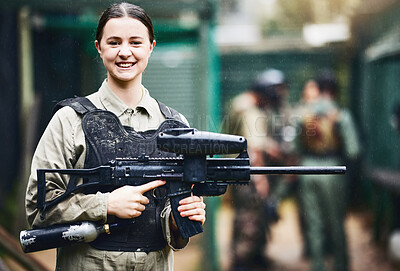 Buy stock photo Paintball, happy and portrait of woman with gun in safety uniform for outdoor shooting game with smile. Excited tournament girl in vest protection ready for shooter sport and activity.

