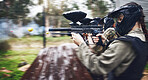 Paintball, soldier and action with gun for shooting, speed and military battlefield with sports, war and fitness outdoor. People together in camouflage, mask with weapon and game, power and lifestyle