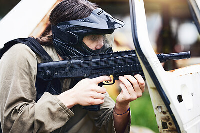 Buy stock photo Paintball, gun or woman in a shooting game playing with fast action on fun battlefield on holiday. Military mission, target aim or player with weapons gear for war survival in an outdoor competition