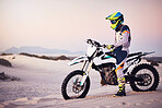 Moto cross, sand landscape or man on bike stop for sport workout, sunset ride or exercise on hill. Nature, sky or man on motorcycle for freedom adventure in Dubai desert for training, fitness or race