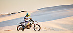 Moto cross, sand landscape or man on bike in Dubai for sport workout, sunset ride or exercise on hill. Nature, sky or man riding for speed adventure freedom in desert for training, fitness or race