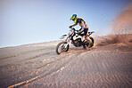 Moto cross, Dubai desert or man on bike stop for sport workout, sunset ride or exercise on hill. Nature, sky or man on motorcycle for freedom adventure in sand landscape for training, fitness or race