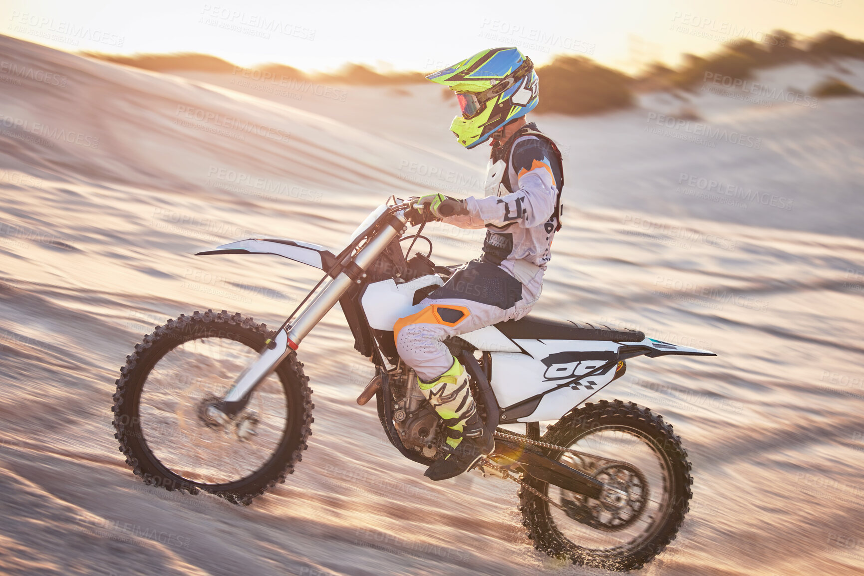 Buy stock photo Motorcycle, athlete and sports outdoor with speed, fitness and riding in desert with extreme sport, fast and safety helmet. Challenge, power and biking exercise, person training and dirt bike rally