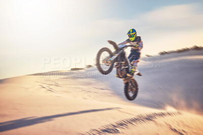 Buy stock photo Motorcycle, athlete and sports outdoor with jump stunt, fitness in desert and extreme sport with speed and freedom. Challenge, power and biking with exercise, person training and dirt bike rally