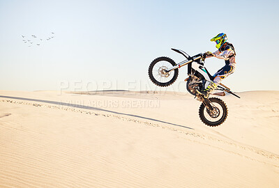 Buy stock photo Motorcycle, desert race and air jump for extreme sport expert with agile speed, power or balance in nature. Motorbike man, rally and blue sky on fast vehicle with helmet, safety clothes or motivation