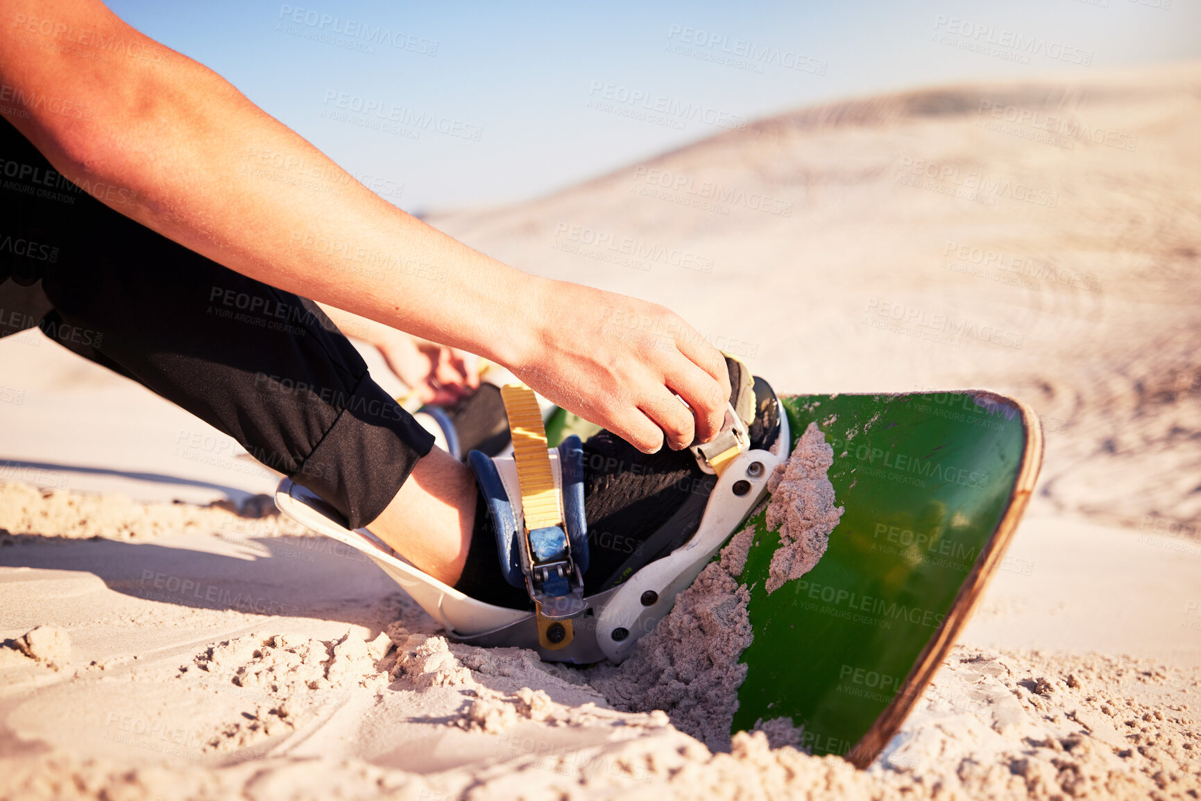 Buy stock photo Sand board, adventure and man with shoes for desert surfing, extreme sports and action hobby in nature. Freedom, holiday travel and feet of dune surfer outdoors for fitness, exercise and training