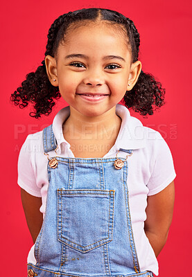Buy stock photo Portrait, child and girl in studio, happy and smile against a red background with mockup. Face, cheerful and trendy toddler standing against space, excited and positive, smiling and posing isolated
