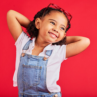 Buy stock photo Little girl, happy and thinking in fashion pose, trendy or cool style clothes on isolated red background for kids branding. Smile, youth and child stretching arms in playful, funny and goofy posing