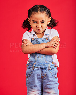 Buy stock photo Child, arms crossed or angry portrait on isolated red background for tantrum face, behavior problem or stubborn. Mad, annoyed or frustrated little girl with sulking, grumpy or anger facial expression