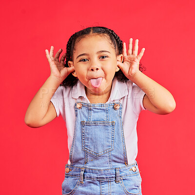 Buy stock photo Child, portrait and tongue out on isolated red background in goofy, silly games and playful facial expression. Happy, kid and little girl with funny face in comic emoji, charades and studio activity