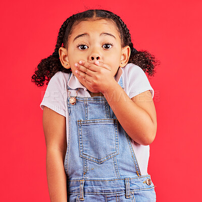 Buy stock photo Shocked child, portrait and hand on mouth in secret, oops and mistake facial expression on isolated red background. Kid, little girl and surprised face in gossip, news or emoji at studio announcement