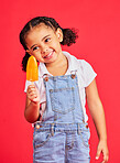 Child, happy and ice cream on isolated red background with fashion, cool and trendy clothes for summer holiday, break or vacation. Happy, kid and girl with lolly, cold sweet and food for heat relief