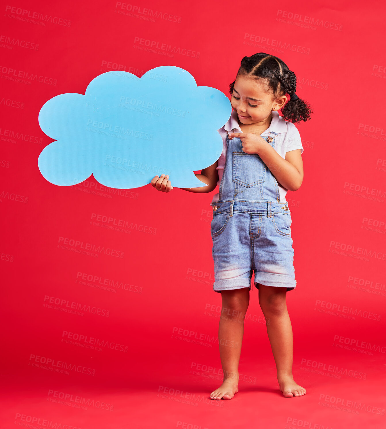 Buy stock photo Kid, pointing or speech bubble in ideas, opinion or vote on isolated red background in social media, vision or news. Smile, happy or child showing banner, paper or cardboard poster in speaker mockup