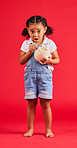 Surprised child, portrait and piggy bank for money deposit, kids savings or future investment on isolated red background. Shocked, girl and wow kid with cash box for finance growth or budget planning