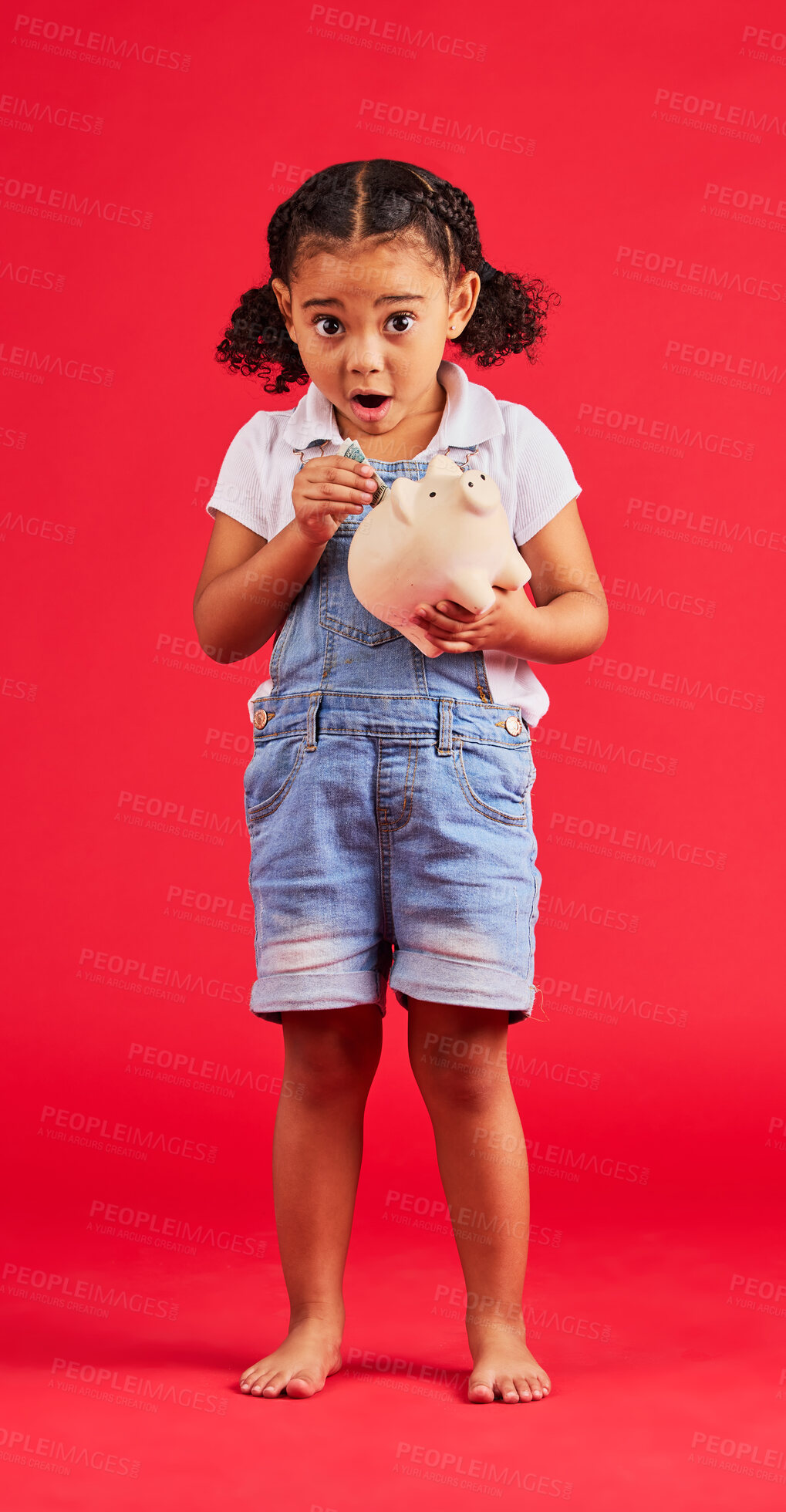 Buy stock photo Surprised child, portrait and piggy bank for money deposit, kids savings or future investment on isolated red background. Shocked, girl and wow kid with cash box for finance growth or budget planning