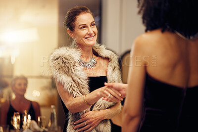 Buy stock photo Success, handshake or women in a party shaking hands for partnership agreement at social event. Thank you, congratulations or happy people greeting or meeting at luxury dinner gala for winning a deal