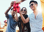 Party, drinks and cheers with friends outdoor to celebrate at  festival, happy hour or summer social event. Diversity young men and women people together for toast, happiness and drinking alcohol