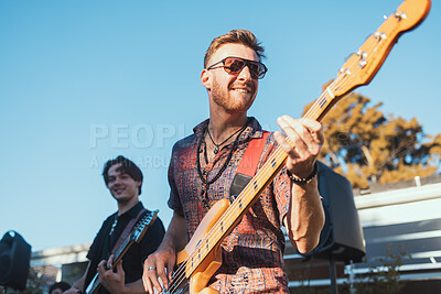 Buy stock photo Guitar, music and party with a band outdoor at a celebration playing a song as a musician or artist. Happy, fun and performance with a man guitarist holding an instrument to perform at a birthday