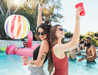 Buy stock photo Fun, drink and portrait of friends at a pool party for swimming, celebration and vacation in summer. Playful, alcohol and women in the water on a tropical group holiday for a break to celebrate life