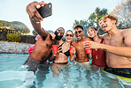 Selfie, beer and friends at pool party having fun on new years. Swimming celebration, water event and group of happy people with tongue out, peace sign and taking pictures for social media in summer.