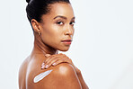 Woman portrait, beauty and body cream on skin in studio for dermatology, cosmetic and natural glow space. Aesthetic model person with luxury lotion and hand on shoulder isolated on a white background