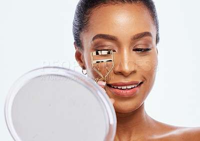 Buy stock photo Makeup, beauty and eyelash curler by black woman doing self care or skincare isolated against a studio white background. Happy, cosmetics and face of female model holding product or tool