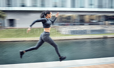 Buy stock photo Sprinting, fast and woman running in the city for fitness, training and morning energy in Germany. Exercise, sports and athlete runner with focus during outdoor cardio for body performance in motion