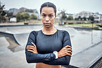 Fitness, sports and portrait of a woman in the city for an outdoor run, exercise or training. Serious, motivation and young female athlete or runner with crossed arms after a cardio workout outside.