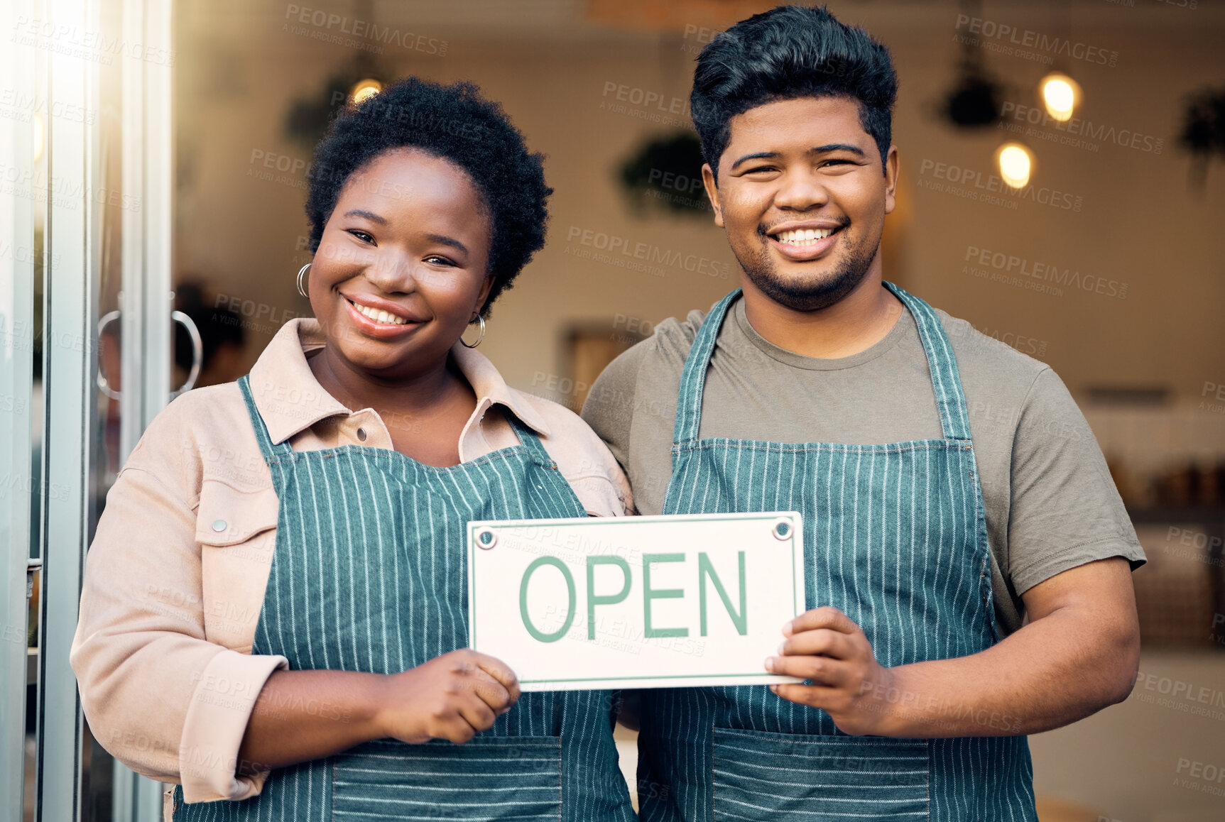 Buy stock photo Portrait, couple and open sign by small business owners happy at coffee shop, cafe and support together. Team, restaurant and black people smiling due to startup growth and proud of success or vision