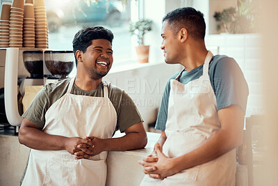 Buy stock photo Coffee shop, happy and male barista talking to his colleague before work at a restaurant or cafe. Happiness, smile and men waiter or server in discussion or conversation at the counter by cafeteria.