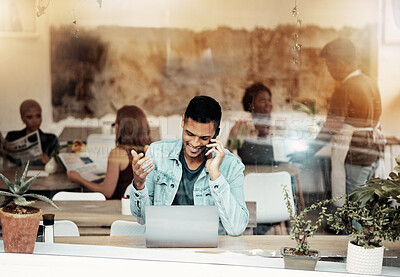 Buy stock photo Creative man, phone and laptop at cafe with smile for communication, networking or conversation. Happy male freelancer smiling for call, discussion or startup on smartphone at coffee shop restaurant