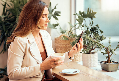 Buy stock photo Coffee shop, phone and communication with a woman customer drinking while typing a text message by a window. Internet cafe, mobile and social media with a female enjoying a drink in a restaurant