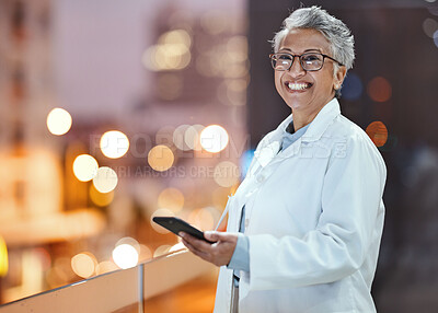 Buy stock photo Phone, doctor and senior woman on hospital rooftop for telehealth, research or online consultation in city. Bokeh, healthcare portrait and female physician with smartphone for wellness app at night.