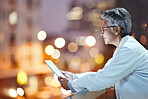 Tablet, senior woman and doctor on rooftop in hospital working on telehealth, research or online consultation in city. Bokeh, healthcare and female physician with technology for wellness app at night