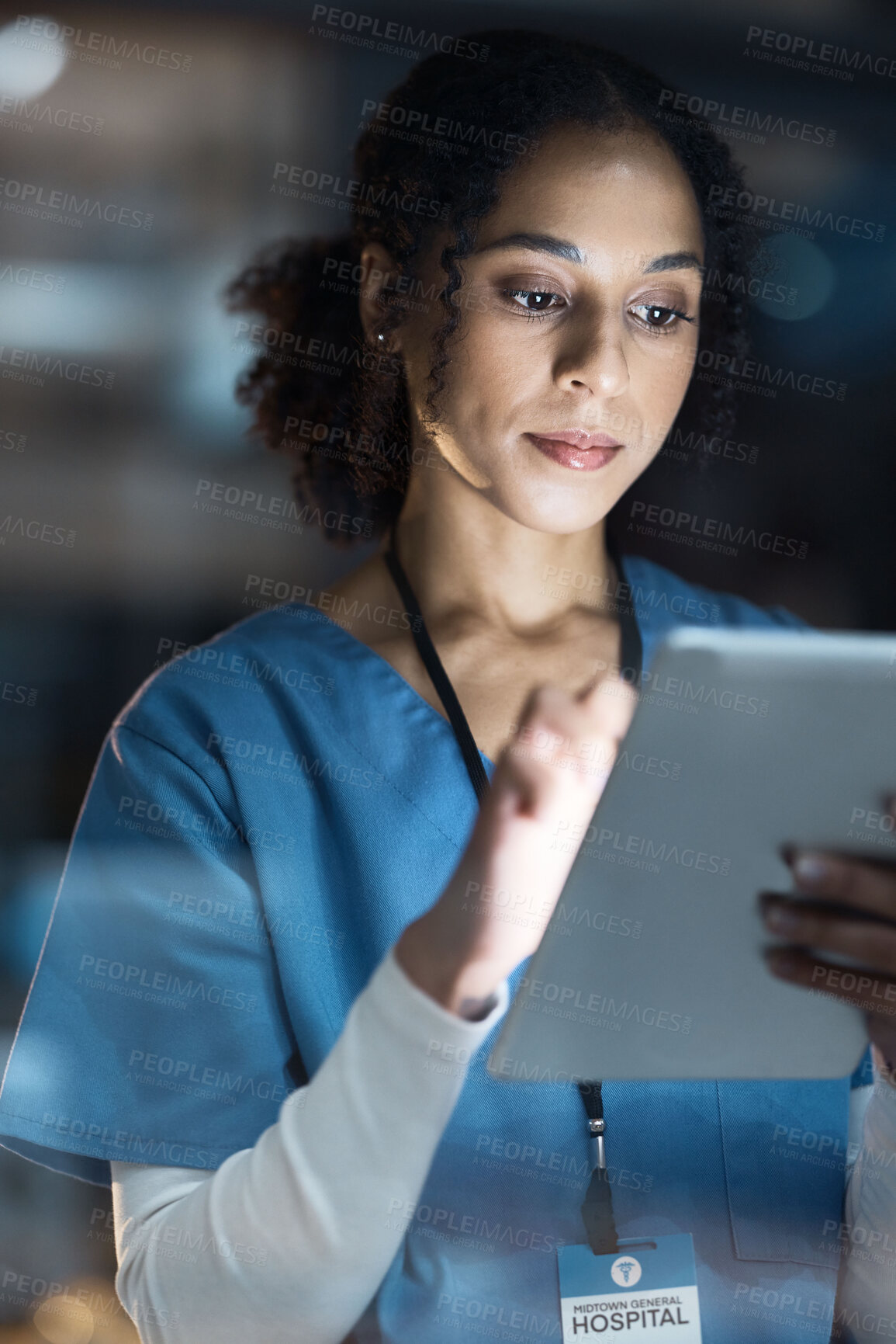 Buy stock photo Medical tablet, nurse and black woman in hospital working late on telehealth, research or online consultation. Tech, healthcare or female physician with technology for wellness app in clinic at night